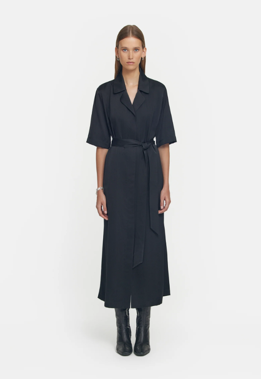 A woman wearing Viktoria & Woods black juilliard shirt dress