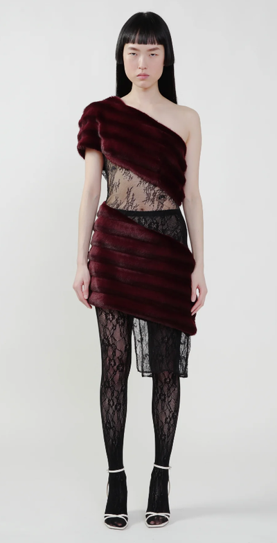 A woman wearing KIM SHUI bordeaux color aubergine faux fur combo dress