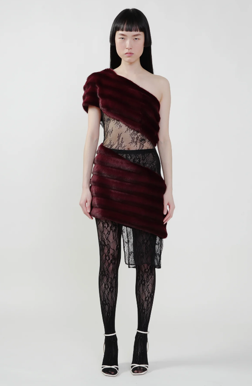 A woman wearing KIM SHUI bordeaux color aubergine faux fur combo dress