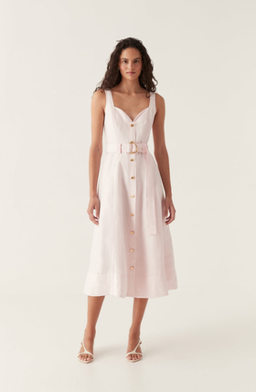 A woman wearing Aje pink clay belted midi dress