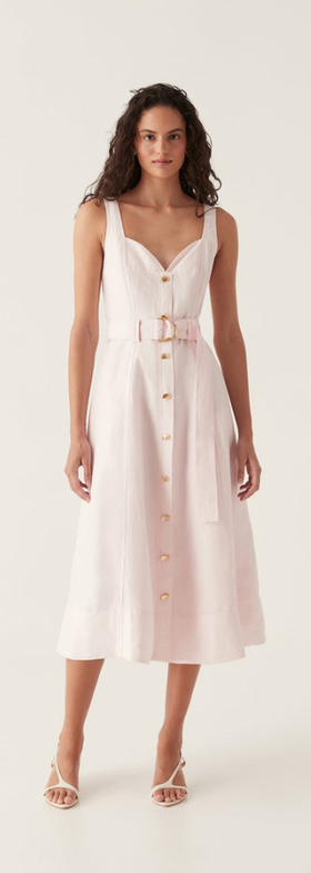 A woman wearing Aje pink clay belted midi dress