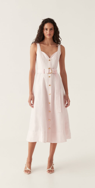 A woman wearing Aje pink clay belted midi dress