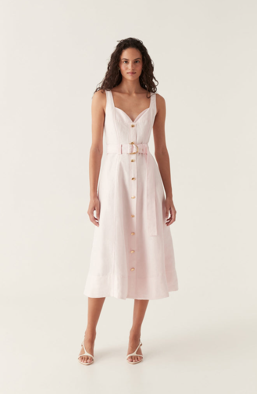 A woman wearing Aje pink clay belted midi dress