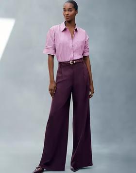 A woman wearing Ann Taylor pink stripe oversized shirt