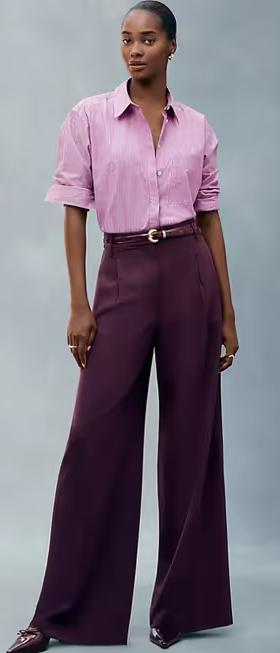 A woman wearing Ann Taylor pink stripe oversized shirt