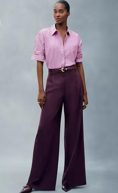 A woman wearing Ann Taylor pink stripe oversized shirt