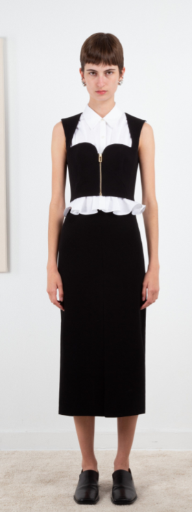 A woman wearing Ashlynn Park black ligia bustier blouse