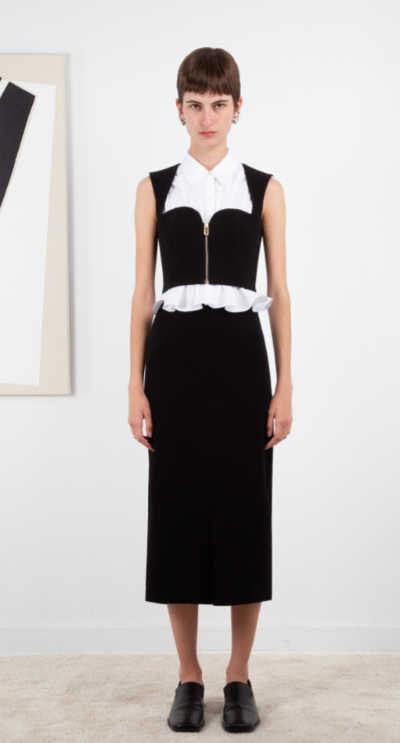 A woman wearing Ashlynn Park black ligia bustier blouse