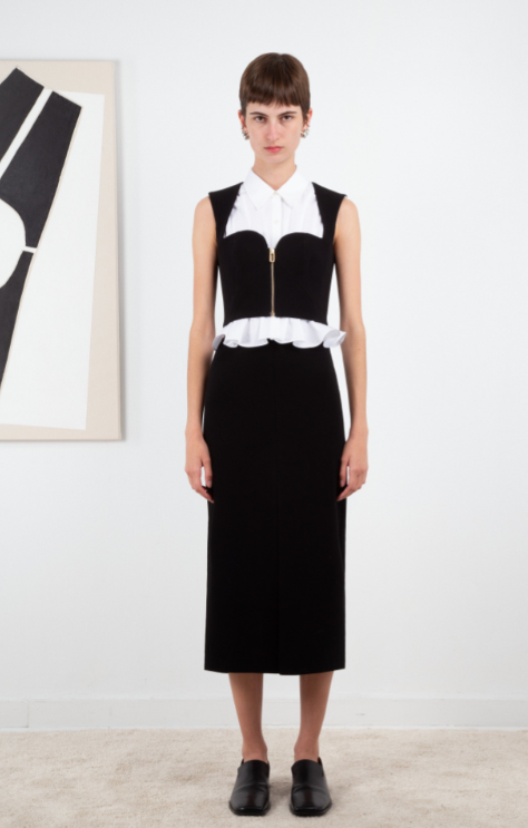 A woman wearing Ashlynn Park black ligia bustier blouse