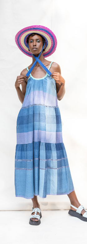 A woman wearing Abacaxi tie strap tiered maxi dress