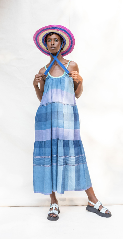 A woman wearing Abacaxi tie strap tiered maxi dress