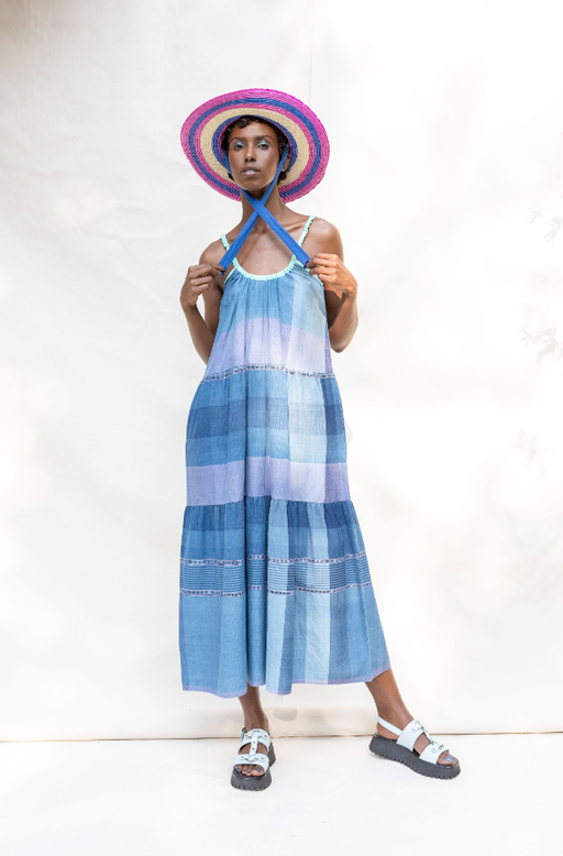 A woman wearing Abacaxi tie strap tiered maxi dress