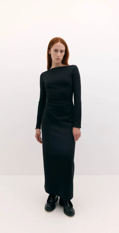 A woman wearing Harris Tapper long sleeve bea dress