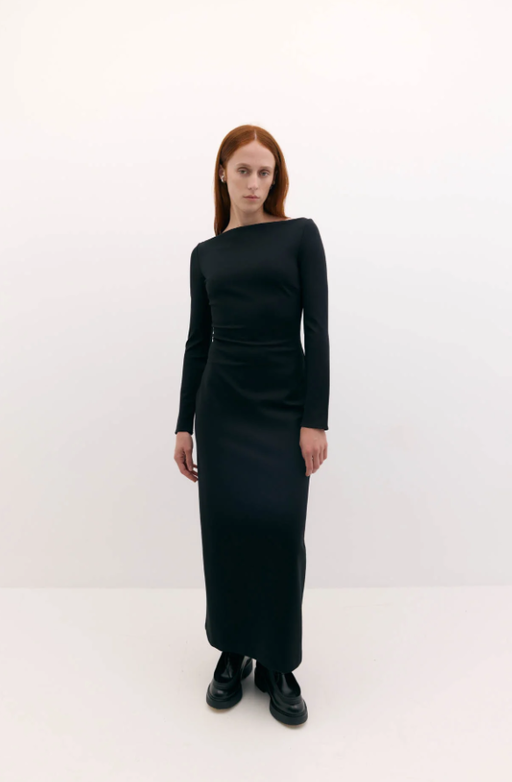 A woman wearing Harris Tapper long sleeve bea dress
