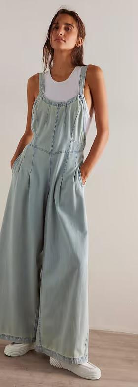 A woman wearing We the Free azurine blue lillith one-piece