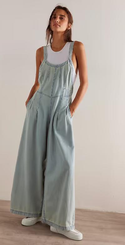 A woman wearing We the Free azurine blue lillith one-piece