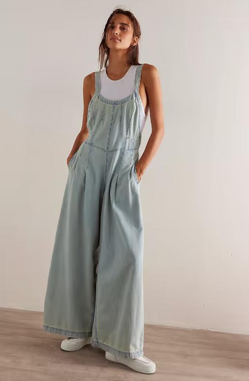 A woman wearing We the Free azurine blue lillith one-piece