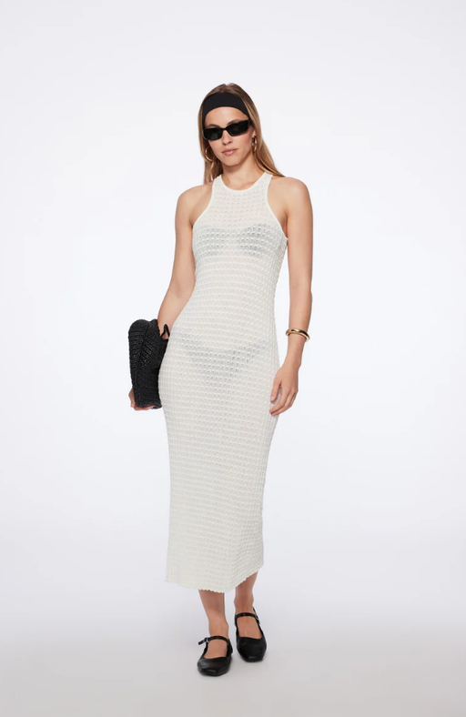 A woman wearing TROPIC OF C nero dress in white