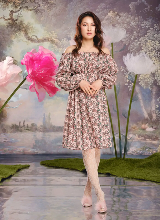 A woman wearing Loud Bodies “alice” dress pink swallows tencel