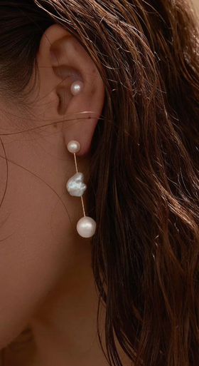 A woman wearing Pearls, Please diamond round cloudbar earrings