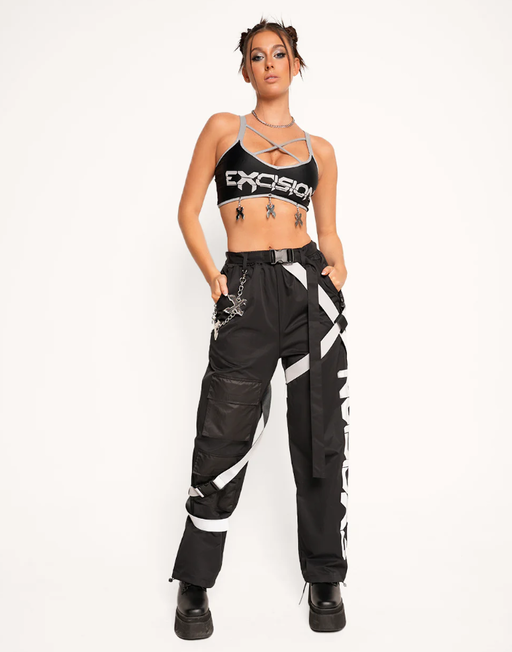 A woman wearing excision x iheartraves charged up reflective wire top