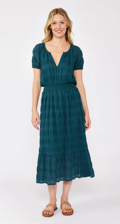 A woman wearing Lovestitch midnight teal midi dress