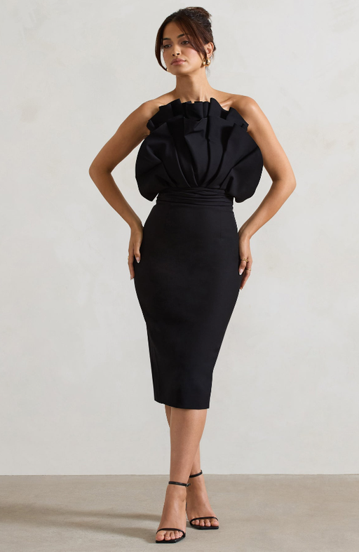 A woman wearing Club L black ruffled strapless midi dress