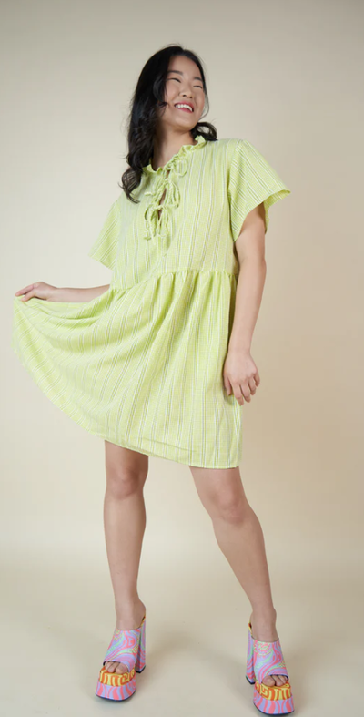 A woman wearing Tamara Malas laura gingham dress