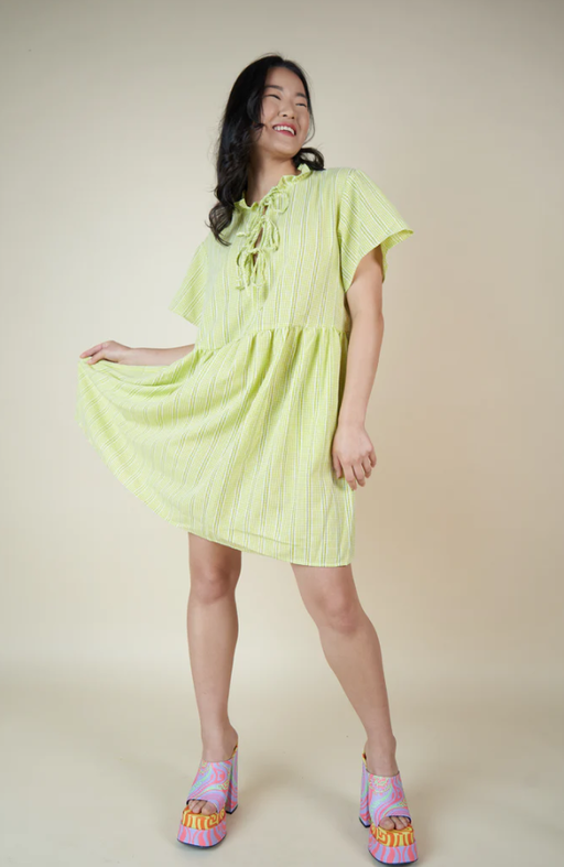A woman wearing Tamara Malas laura gingham dress