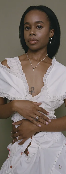 A woman wearing Yam space bar earrings