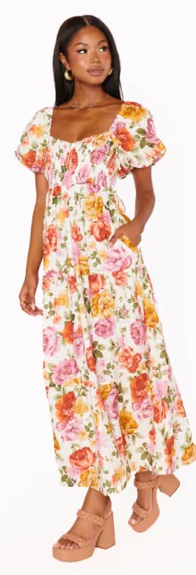A woman wearing Show Me Your Mumu ivory hillside floral joanna midi dress