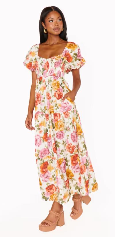 A woman wearing Show Me Your Mumu ivory hillside floral joanna midi dress