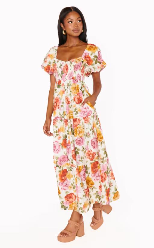 A woman wearing Show Me Your Mumu ivory hillside floral joanna midi dress