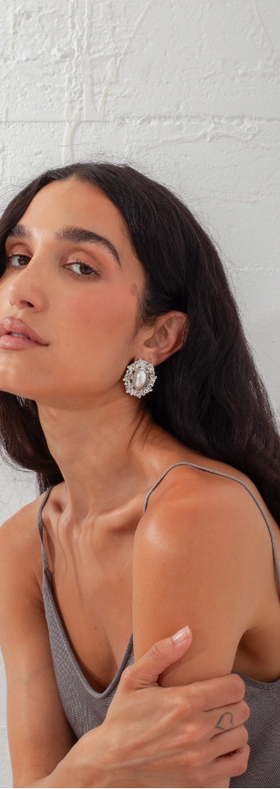 A woman wearing Above Average Studio reine earrings - silver