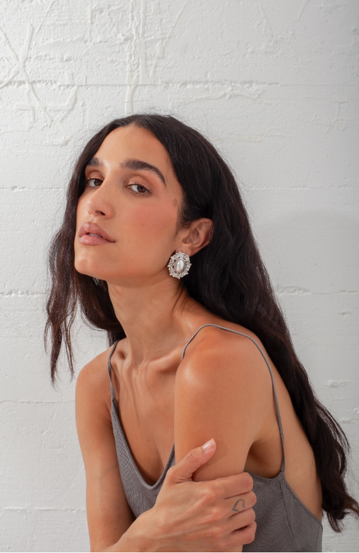 A woman wearing Above Average Studio reine earrings - silver