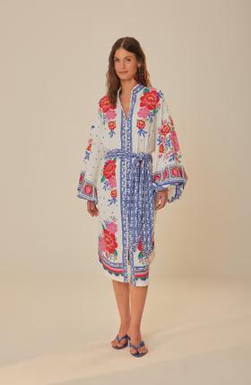 A woman wearing Farm RIO off-white flowers beach midi dress