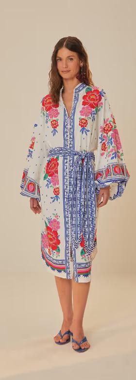 A woman wearing Farm RIO off-white flowers beach midi dress