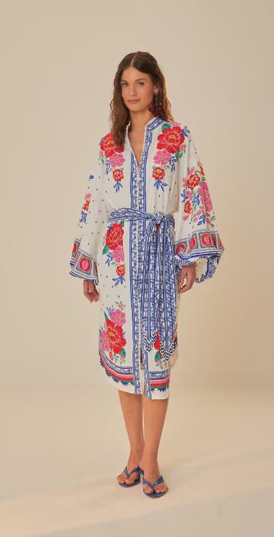 A woman wearing Farm RIO off-white flowers beach midi dress