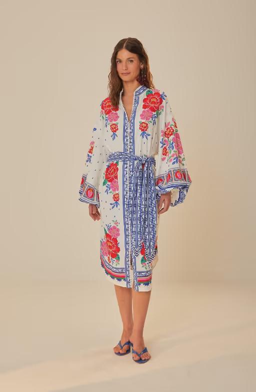 A woman wearing Farm RIO off-white flowers beach midi dress