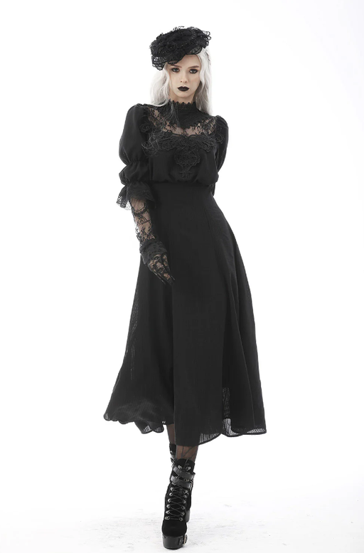 A woman wearing Vampire Freaks black spirits past maxi dress