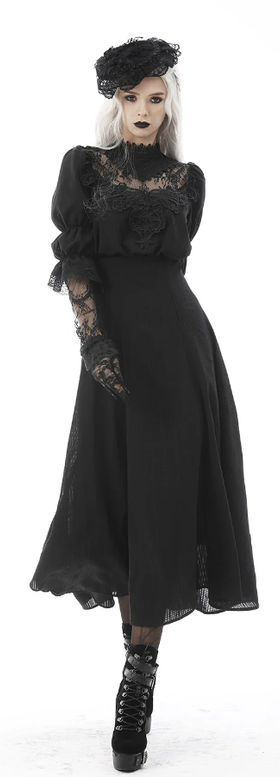 A woman wearing Vampire Freaks black spirits past maxi dress