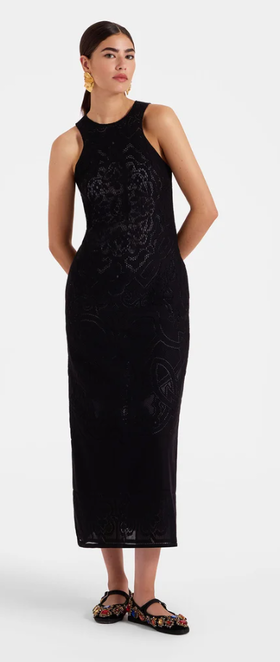 A woman wearing La DoubleJ black lacey racer dress