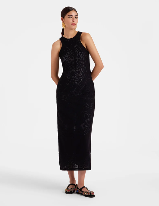 A woman wearing La DoubleJ black lacey racer dress