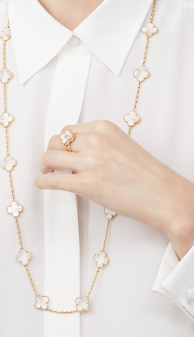 A woman wearing Van Cleef & Arpels vintage alhambra ring