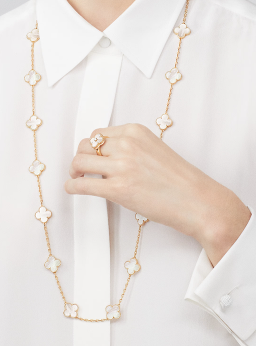 A woman wearing Van Cleef & Arpels vintage alhambra ring