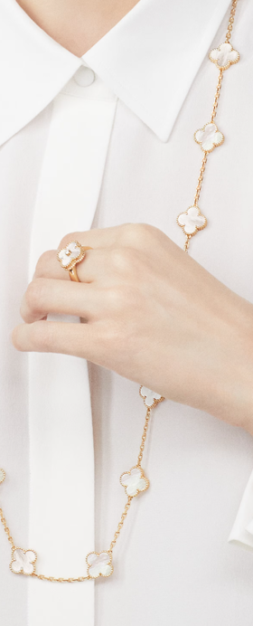 A woman wearing Van Cleef & Arpels vintage alhambra ring