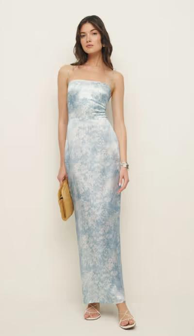 A woman wearing Reformation frankie silk dress