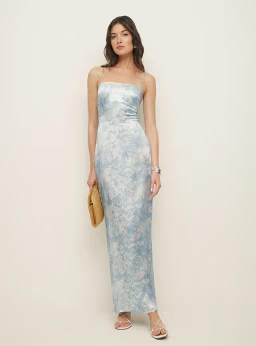 A woman wearing Reformation frankie silk dress