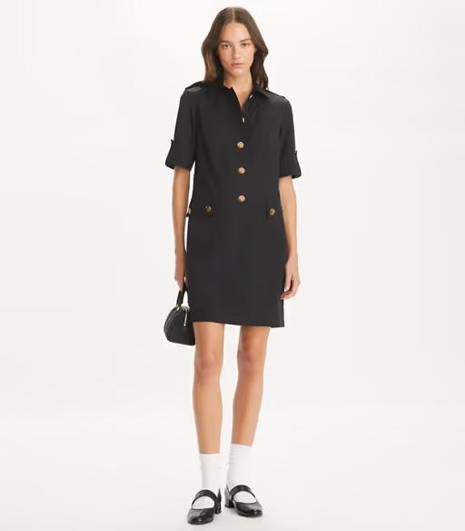 A woman wearing Tory Burch black camp dress