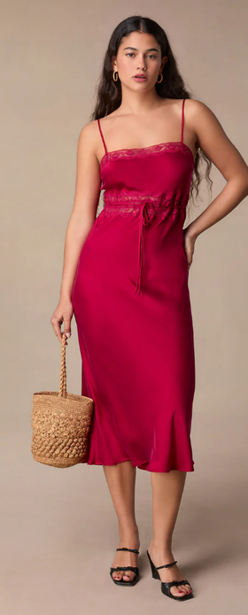 A woman wearing Rouje reda dress